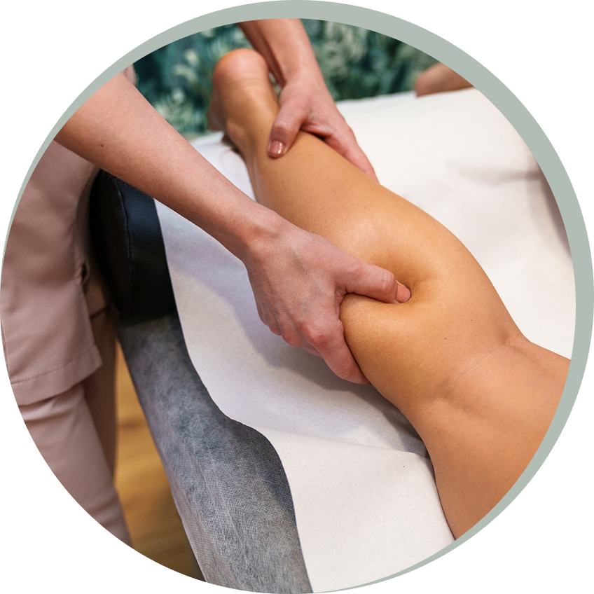 Person receiving a leg massage therapy session.